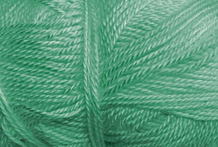 a skein of acrylic green lightweight yarnの写真素材
