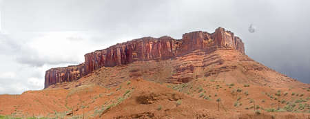 the moon rising over a mesa in Arches Nat'l Park, Utahの写真素材