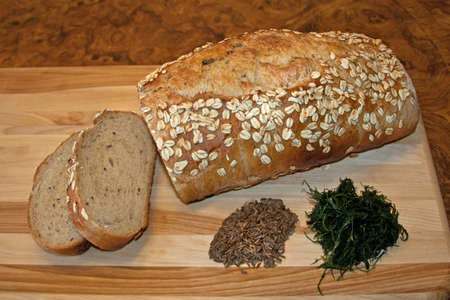 a loaf of rye bread with dill and caraway seedsの写真素材