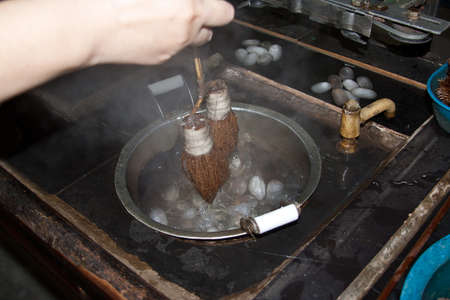 agitating cocoons to loosen starting threadsの写真素材