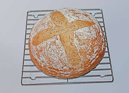 an artisan loaf of multi-seed whole wheat breadの写真素材