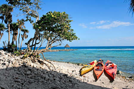 kayaks and a hut at the oceanの写真素材