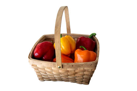 Isolated Colored Sweet Peppers in a Basketの写真素材