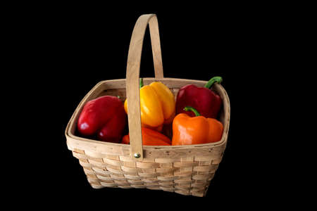 Isolated Colored Sweet Peppers in a Basketの写真素材