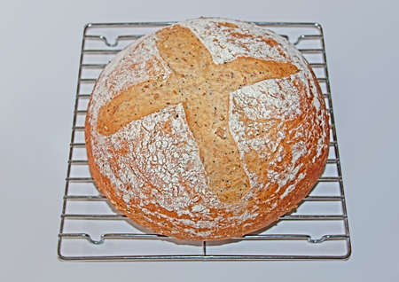 a round loaf of homemade artisan breadの写真素材
