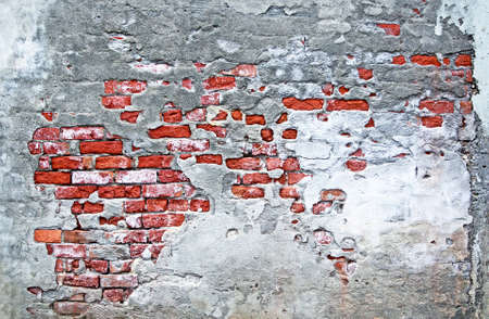 Delapidated old brick and mortar wallの写真素材