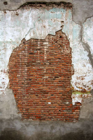 Delapidated old brick and mortar wallの写真素材
