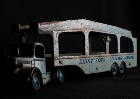London Uk - April 29 2020 - Dinky 582 Pullmore Car Transporter lit from the side against a black backgroundのeditorial素材