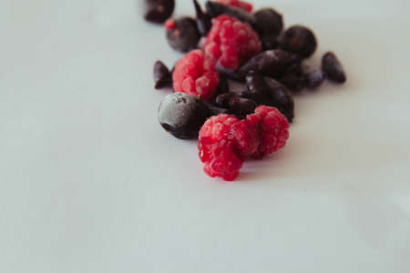 Frozen wild berries with a blurred backgroundの写真素材