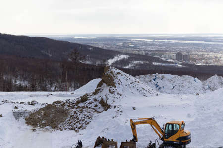 Machinery on the construction site in winter.の写真素材