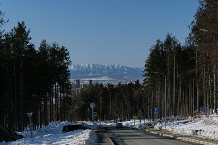 winding mountain road in the evening in winter.の写真素材