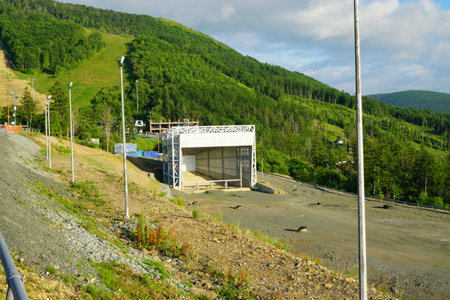 A large metal structure, against the background of a beautiful mountainside.の写真素材