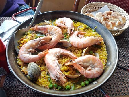 A plate of paella for two peopleの写真素材