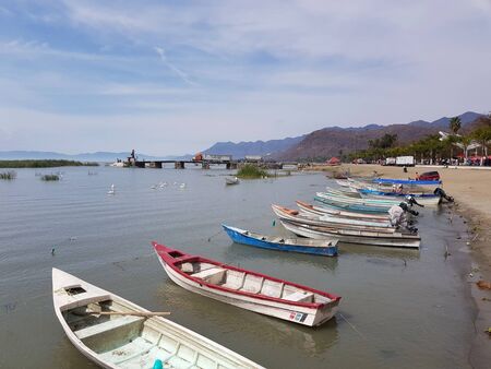 Several small boats on the shore of Lake Chapala, Jaliscoの写真素材