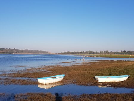 Two boats at the Puente Calderon Dam, blue water, Jalisco, Mexicoの写真素材
