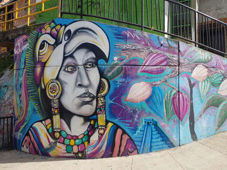 Medellin, Colombia-June 8 2019: Graffiti of an eagle warrior on a blue background, in commune 13のeditorial素材