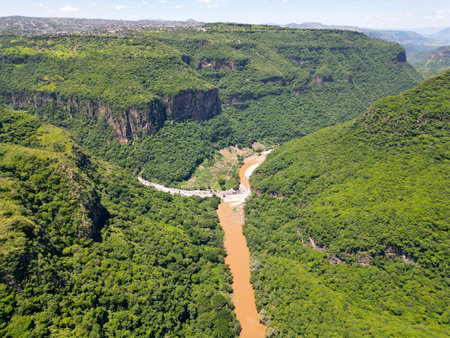 Bridge in the Distance: Aerial View of Santiago River in Barranca de Huentitanの写真素材
