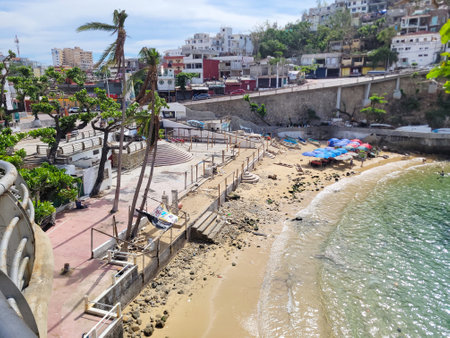 Post-Hurricane Tranquility: Beachfront at Playa Angosta in Acapulcoの写真素材