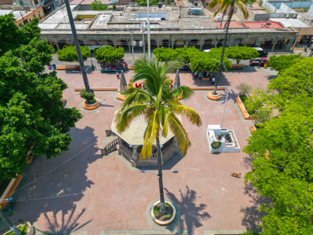 Drone shot capturing the charm of the central square in Villa Corona, including its traditional kiosk and urban surroundingsの写真素材