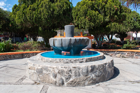 San Lucas Evangelista, Mexico - February 3 2025: The world's largest molcajete-shaped fountain, located in San Lucas Evangelista, Jalisco, Mexico, surrounded by a public plazaの写真素材