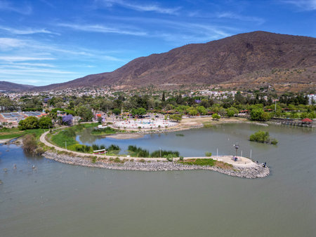 Elevated aerial shot of Jocotepec Pier along Lake Chapala with mountains in the background in Jalisco Mexicoの写真素材