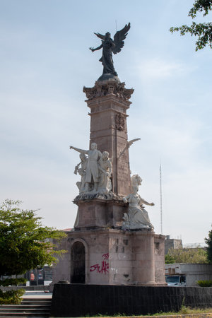 Guadalajara, Mexico - November 8 2025: Historic Independence Monument in downtown Guadalajara, featuring a winged victory statue and detailed sculpturesのeditorial素材