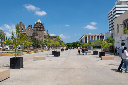 Guadalajara, Mexico - September 20 2025: Wide urban pedestrian promenade, 'Mayor's Walk', featuring a historic cathedral and modern architectureのeditorial素材