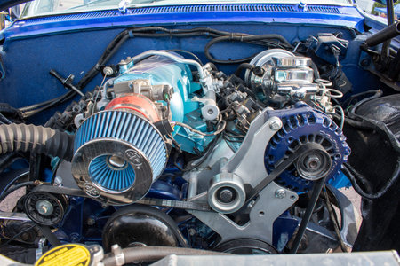 Guadalajara, Mexico - July 19 2025: Detailed close-up of a highly customized car engine, featuring...