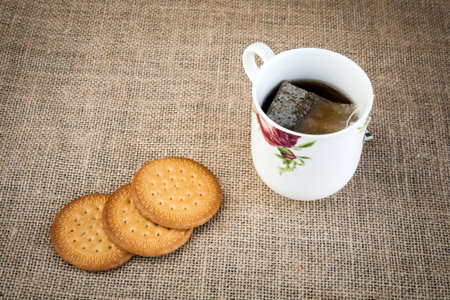 Cup of tea with biscuit
