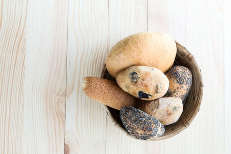 Composition of several breads with mint on wooden table