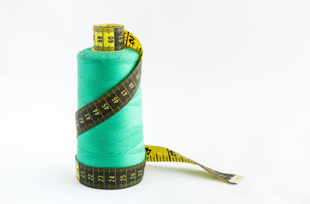 Sewing utensils, scissors, threads and buttons colors isolated on white backgroundの写真素材