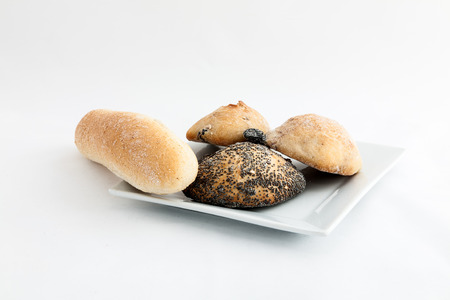 GoodComposition of several breads isolated on white backgroundの写真素材