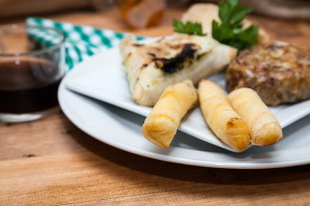 Typical food and fresh Moroccan on wooden table with woven sackの写真素材