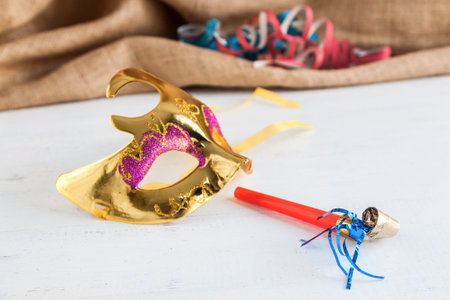 Party carnival items on white wooden table