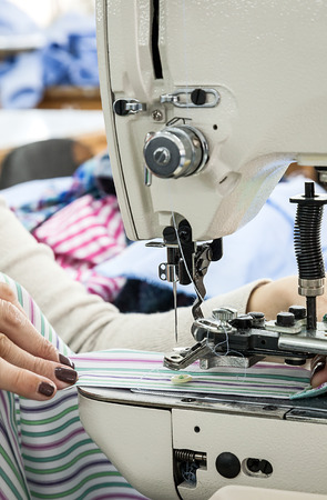 Industrial sewing machines sewing machine operator with chainの写真素材