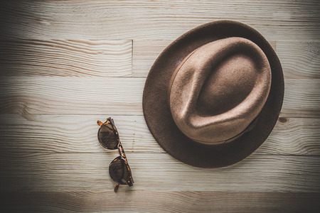 Set of clothes and various accessories for men on old wooden tableの写真素材