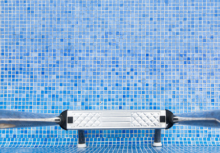 An empty swimming pool with blue tilesの写真素材