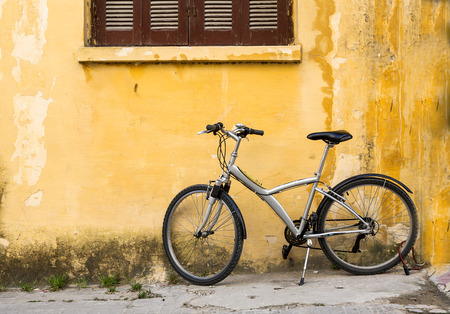 Facade of old house with bicycleの写真素材