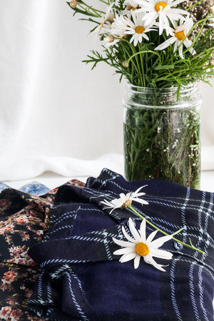 Set of clothes and various accessories for women on old wooden tableの写真素材