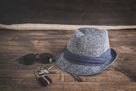 Set of clothes and various accessories for men on old wooden tableの写真素材