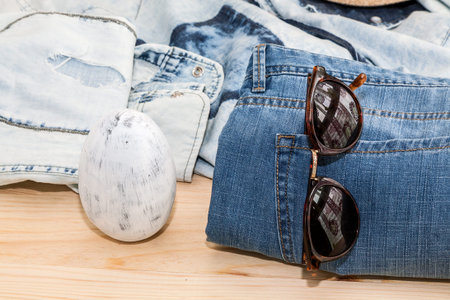 Set of clothes and various accessories for men on old wooden table