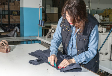 Industrial sewing machines sewing machine operator with chainの写真素材