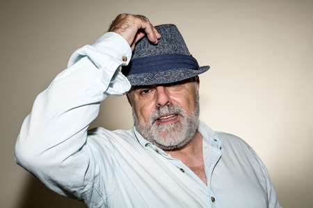 Attractive Senior hat with white beard with hatの写真素材