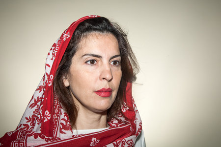 Beautiful woman smiling - close up.Gray background.の写真素材