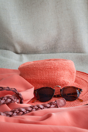 Set of clothes and various accessories for women on old wooden tableの写真素材