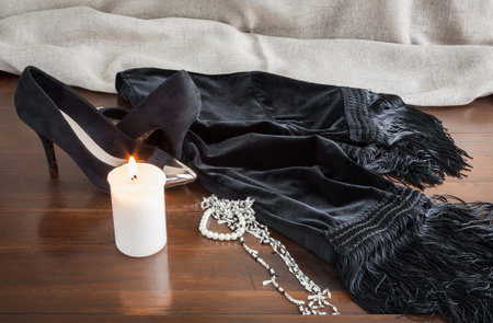 Set of clothes and various accessories for women on old wooden tableの写真素材