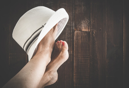 Woman painting toe nails and pedicureの写真素材