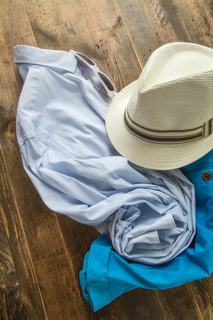Set of clothes and various accessories for men on old wooden tableの写真素材