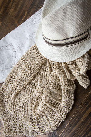 Set of clothes and various accessories for women on old wooden tableの写真素材