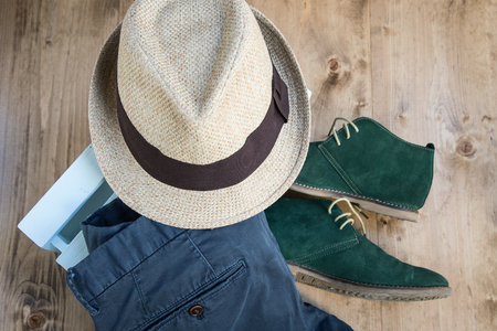 Set of clothes and various accessories for men on old wooden tableの写真素材